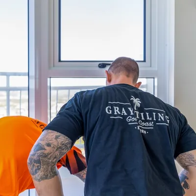 Gray Tiling crew member at work