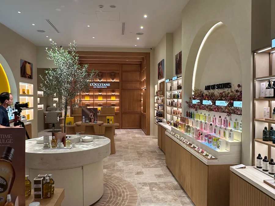 Retail fit-out with French pattern travertine floor and brick-pattern subway tiles